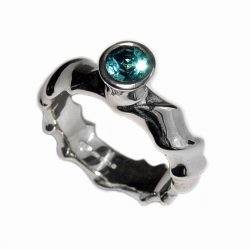 The silver gemset vine ring is striking and elegant. The centre piece of the ring is a sparkling 5mm blue topaz which compliments the delicate silver detailing of the band. The undulating band has a width of approximately 6mm at the widest point and a depth of approximately 2.5mm. The main picture shows the ring with blue topaz in a polished finish. If you would like an alternative gemstone our main choice includes blue topaz,amethyst, garnet, citrine, peridot, iolite. The ring is also available in a satin finish. The silver gemset vine ring is handmade to order to your specific finger size. Please let us know your ring size when you place your order. We have used the UK/AU sizing system, however. If you have a ring size based on EU, US/Canada or any other international sizing system we can convert it. The ring has a Paul Finch hallmark and conforms to the British hallmarking standard. It is delivered in a Paul Finch jewellery box. Cleaning instructions For satin finish use silver dip, rinse in warm soapy water, dry thoroughly. For polished finish use silver polishing cloth/ and or silver dip. FREE Delivery The parcel will be sent out using secure Colissimo International tracked and signed for service and will require a signature on receipt. Usually despatched within 2-5 working days