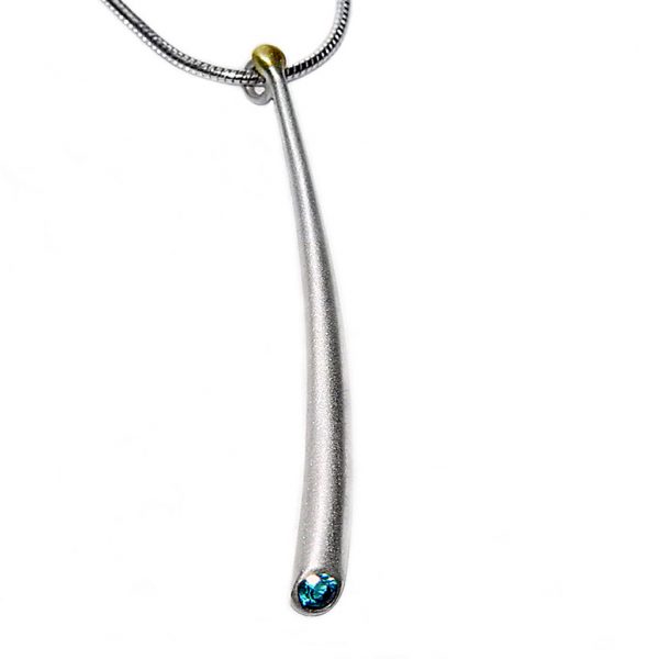Long curved wiggly pendant with 3mm blue topaz & 18ct gold bead. The solid silver pendant tapers from 4mm and is approx 50mm long. It comes on a  silver snake chain.