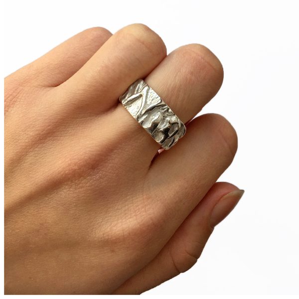 This textured silver vine band has an unusual intricate pattern with a smooth polished interior. The ring is approximately 10mm wide with a depth of 2.5mm.