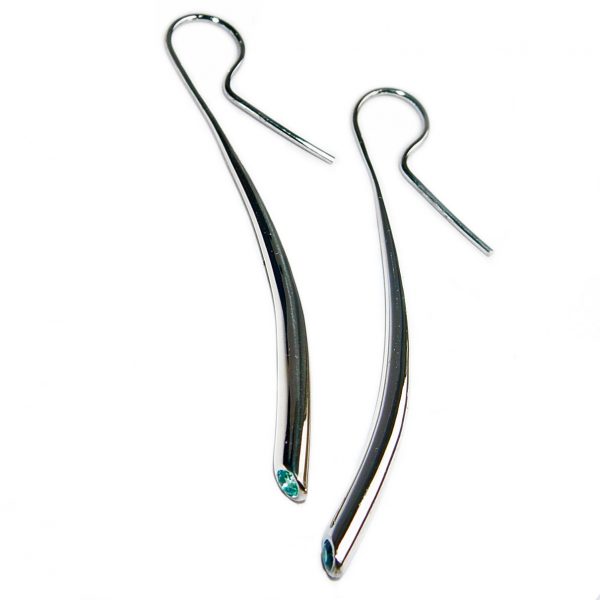 Long silver wiggly drop earrings with 3mm blue topaz. The solid silver earrings taper from 4mm and are approximately 54mm long.  A beautiful  pure design.