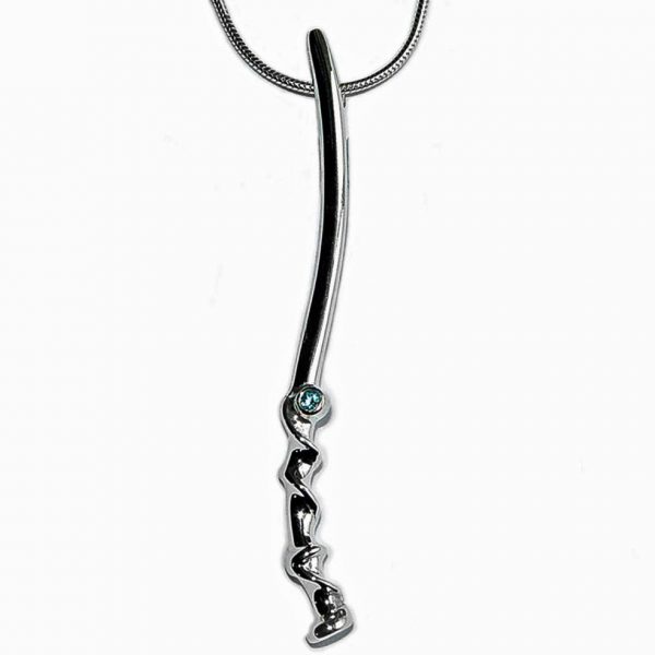 The long twist vine pendant is elegant and unusual. The delicate silver detail is enhanced with a sparkling 2mm blue topaz and contrasting polished finish.  The pendant is approximately 62mm long and has a width of 3mm. The pendant is available with a variety of gemstones and comes on a silver snake chain