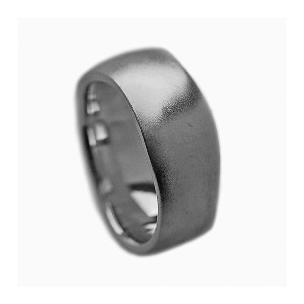 An unusual organic silver band. The smooth solid undulating band is approx 11mm at the widest point and has a varying depth of 2-3mm. It is practical and comfortable to wear. The ring is individually handmade to order and is available in a wide range of sizes including 1/2 sizes. Please let us know your ring size when you place your order. We use the UK/AU sizing system, however. If you have a ring size based on EU, US/Canada or any other international sizing system we can convert it. If you would like the ring in 18ct gold, please contact us for more details. The organic silver band has a Paul Finch hallmark and conforms to the British hallmarking standard. It comes in a branded jewellery box.