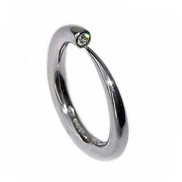 Simple elegant 18ct white gold ring with comfortable rounded band set with a brilliant 0.03ct diamond vsfg quality. The ring tapers from 3mm. (also available in 9ct & 18ct yellow gold, 9ct white gold and platinum - prices on request). This beautiful handcrafted ring is a perfect engagement ring.(in addition there is a 4mm version with 0.1ct diamond C18GW)