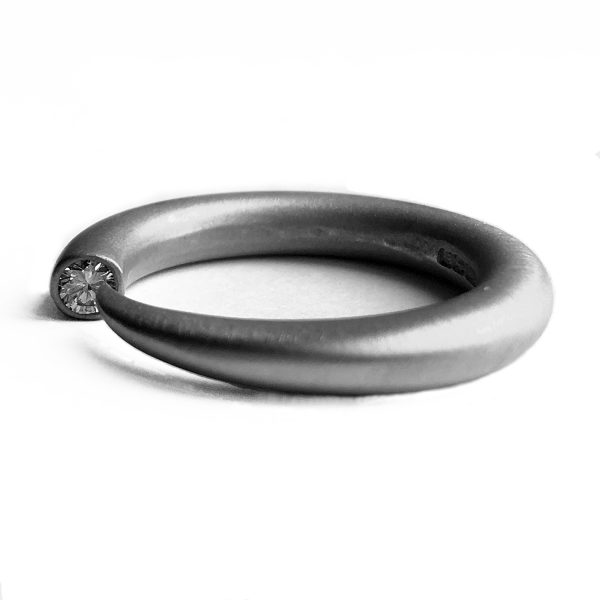 Medium 18ct wedding band. this is a comfortable 4mm round halo band (designed to go with 4mm tapering diamond wiggly ring) The ring is also available in silver, 9ct white/yellow gold, 18ct yellow gold & platinum - prices on request.