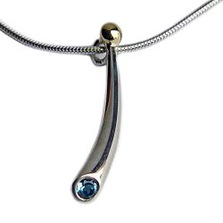 Small curved silver pendant with 3mm blue topaz & 18ct gold bead. The solid silver pendant tapers from 4mm and is approx 25mm long. It comes on a silver snake chain