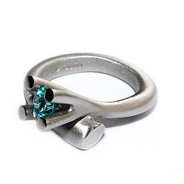 The tapering bough ring is inspired by nature. The ring has a solid silver band which tapers from 5mm and It is 3.5mm across the back. It is crowned with a majestic 4 branch gemset design (image featured shows 5mm blue topaz).  