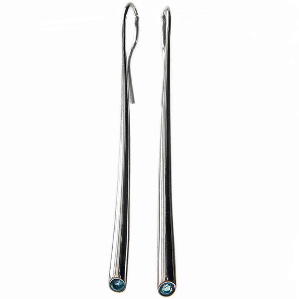 Long silver wiggly drop earrings with 3mm blue topaz. The solid silver earrings taper from 4mm and are approximately 54mm long.  A beautiful  pure design.