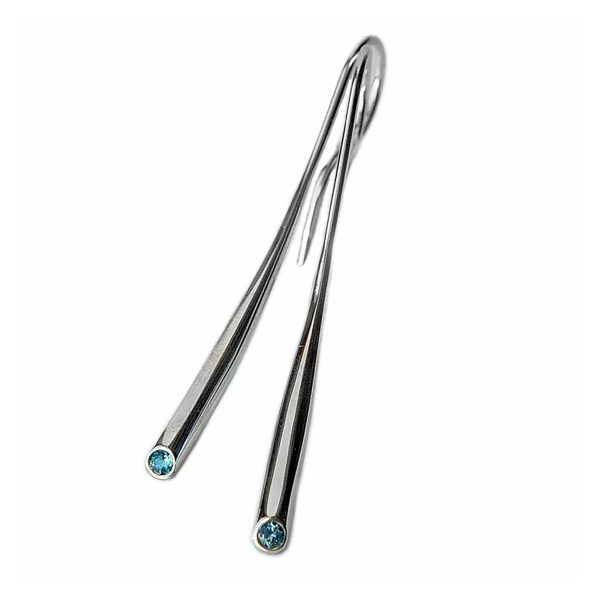 Elegant short wiggly drop earrings set with 2mm blue topaz. The solid silver earrings taper from 3mm and are approx 38mm long. 