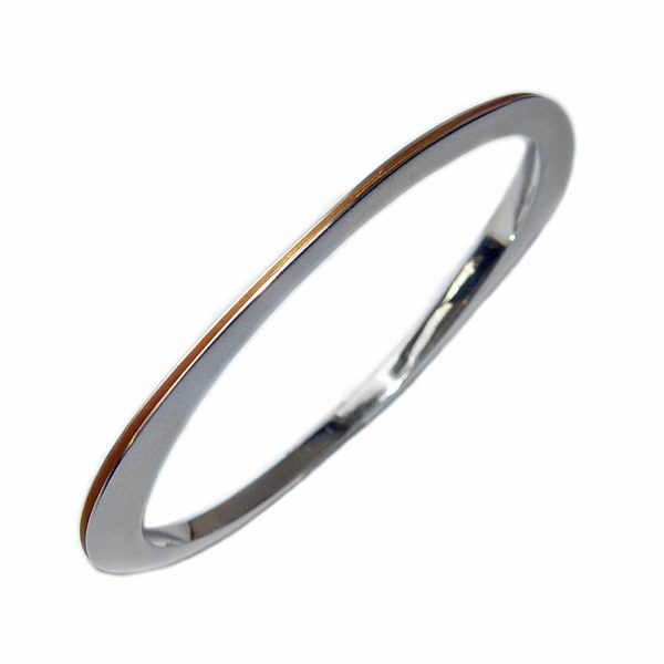 An unusual solid silver bangle. The bangle is split all the way round & has a contrasting rich 22ct gold plated interior. It is perfectly weighted with approximated maximum dimensions of width 3.5mm, and height of 5.5mm  to 9.5mm at the widest point.