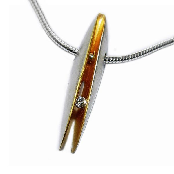 Solid front silver shell pendant with 3pt (0.03ct vsfg) diamond set within a rich 22ct gold plated interior. It is 24mm in height with a width of 4mm and depth of 6mm. The pendant usually comes in a satin finish on a silver snake chain.