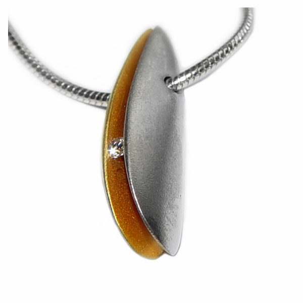 Solid front silver shell pendant with 3pt (0.03ct vsfg) diamond set within a rich 22ct gold plated interior. It is 24mm in height with a width of 4mm and depth of 6mm. The pendant usually comes in a satin finish on a silver snake chain.