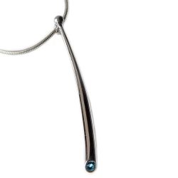 Long curved wiggly pendant with 3mm blue topaz & silver bead. The solid silver pendant tapers from 4mm and is approx 50mm long. 