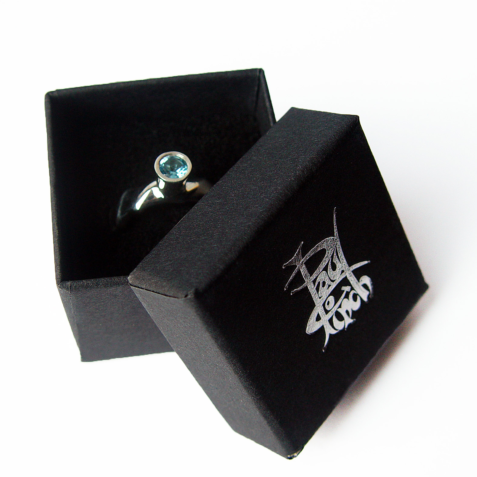 The silver gemset vine ring is striking and elegant. The centre piece of the ring is a sparkling 5mm blue topaz which compliments the delicate silver detailing of the band. The undulating band has a width of approximately 6mm at the widest point and a depth of approximately 2.5mm. The main picture shows the ring with blue topaz in a polished finish. If you would like an alternative gemstone our main choice includes blue topaz,amethyst, garnet, citrine, peridot, iolite. The ring is also available in a satin finish. The silver gemset vine ring is handmade to order to your specific finger size. Please let us know your ring size when you place your order. We have used the UK/AU sizing system, however. If you have a ring size based on EU, US/Canada or any other international sizing system we can convert it. The ring has a Paul Finch hallmark and conforms to the British hallmarking standard. It is delivered in a Paul Finch jewellery box. Cleaning instructions For satin finish use silver dip, rinse in warm soapy water, dry thoroughly. For polished finish use silver polishing cloth/ and or silver dip. FREE Delivery The parcel will be sent out using secure Colissimo International tracked and signed for service and will require a signature on receipt. Usually despatched within 2-5 working days