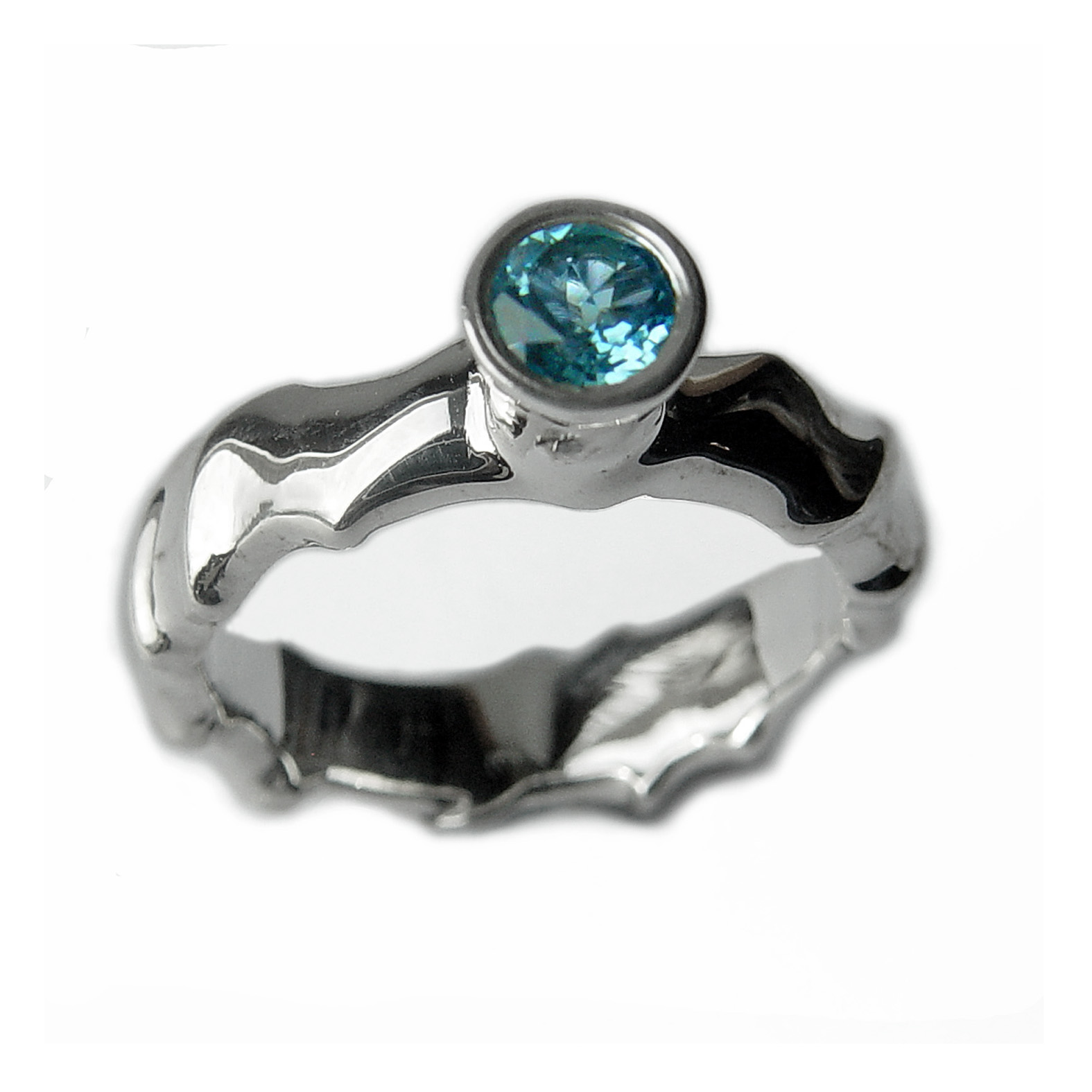 The silver gemset vine ring is striking and elegant. The centre piece of the ring is a sparkling 5mm blue topaz which compliments the delicate silver detailing of the band. The undulating band has a width of approximately 6mm at the widest point and a depth of approximately 2.5mm. The main picture shows the ring with blue topaz in a polished finish. If you would like an alternative gemstone our main choice includes blue topaz,amethyst, garnet, citrine, peridot, iolite. The ring is also available in a satin finish. The silver gemset vine ring is handmade to order to your specific finger size. Please let us know your ring size when you place your order. We have used the UK/AU sizing system, however. If you have a ring size based on EU, US/Canada or any other international sizing system we can convert it. The ring has a Paul Finch hallmark and conforms to the British hallmarking standard. It is delivered in a Paul Finch jewellery box. Cleaning instructions For satin finish use silver dip, rinse in warm soapy water, dry thoroughly. For polished finish use silver polishing cloth/ and or silver dip. FREE Delivery The parcel will be sent out using secure Colissimo International tracked and signed for service and will require a signature on receipt. Usually despatched within 2-5 working days